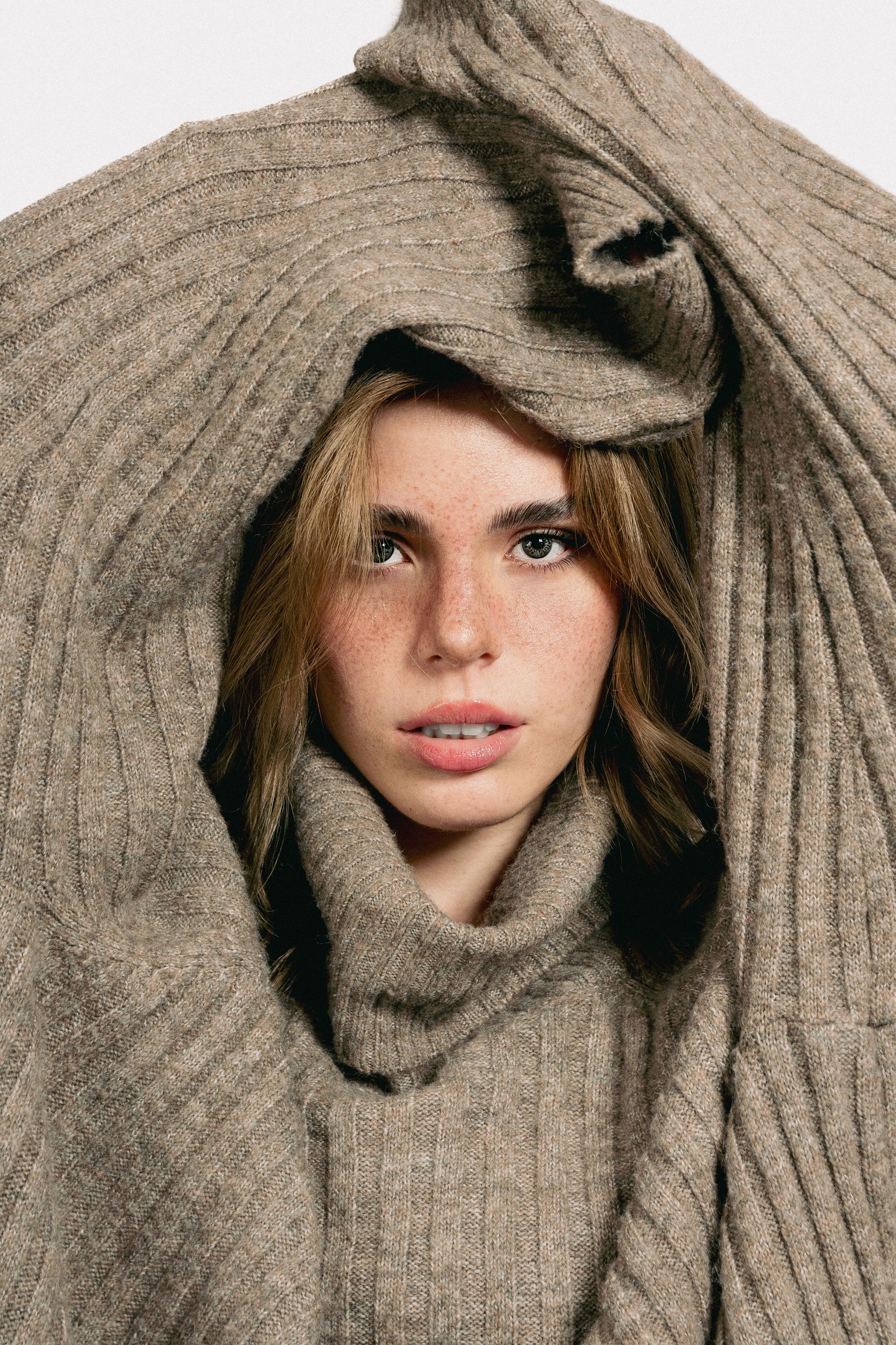 ARRA knit draped around a model